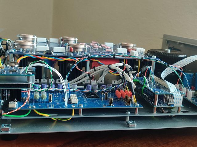 Side view: output board above, supplies below