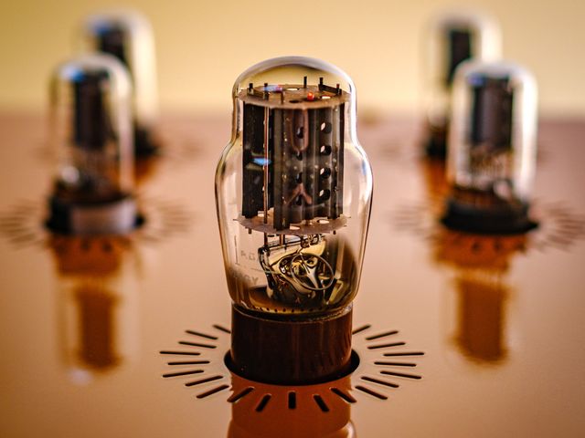 Close view of a 6SN7 signal valve seated in the top plate