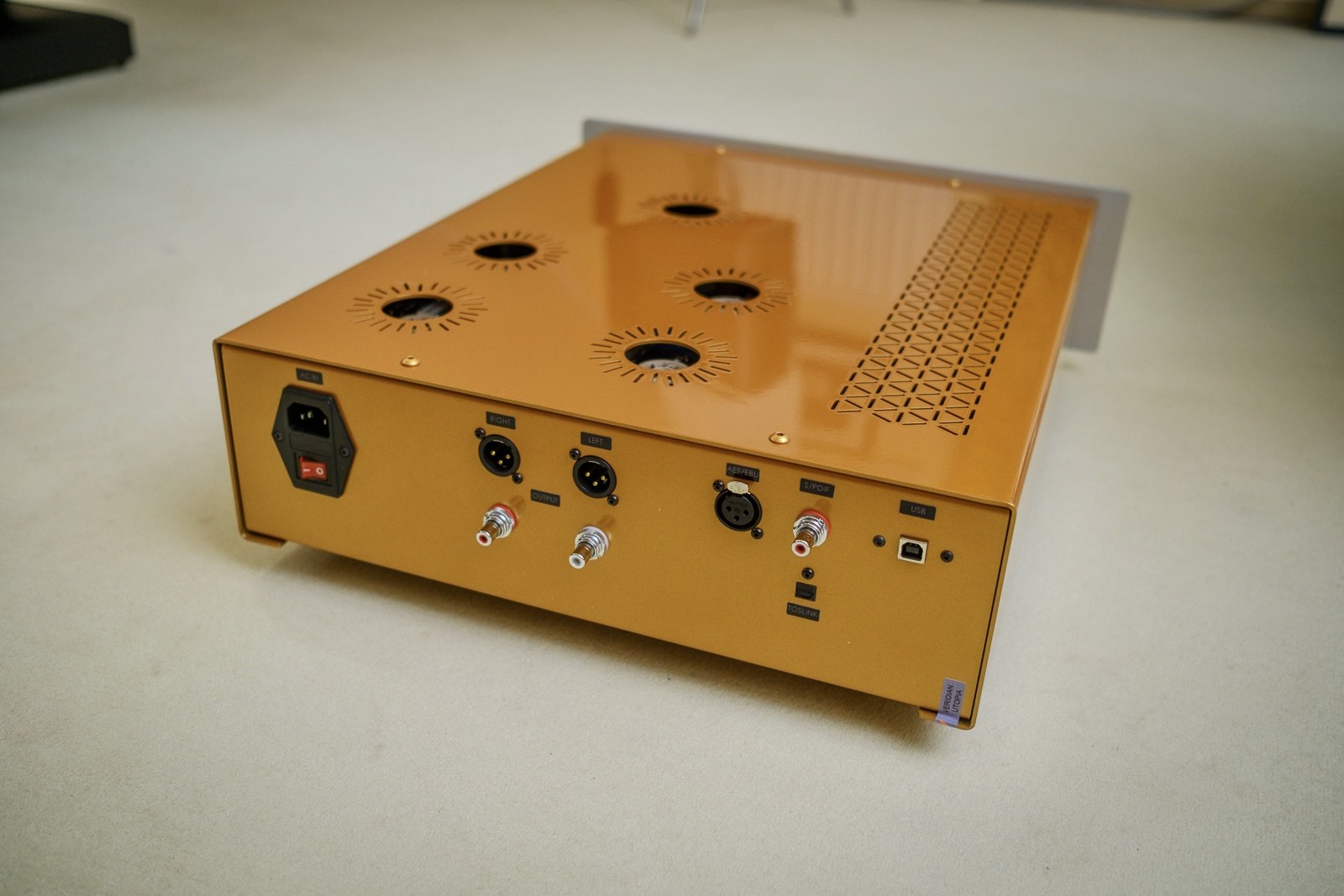 Sirius in a copper finish, rear three-quarter view showing the valve apertures and vent pattern