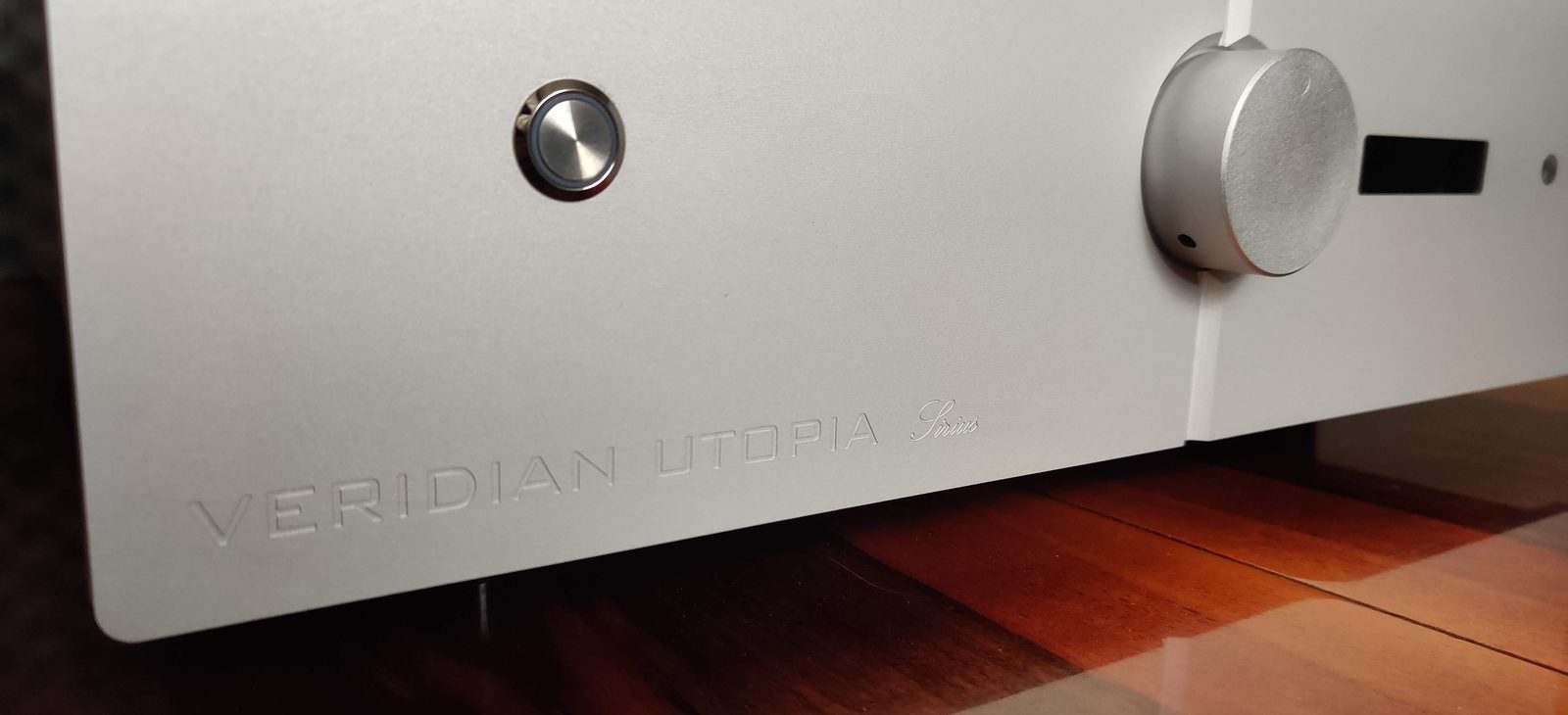 Detail of the Sirius front panel, engraved logo and volume control