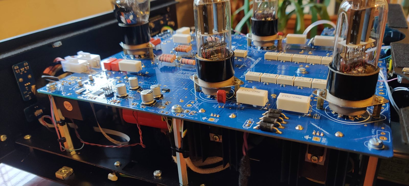 Internal wiring in cotton sleeving running between the output board and the power supply